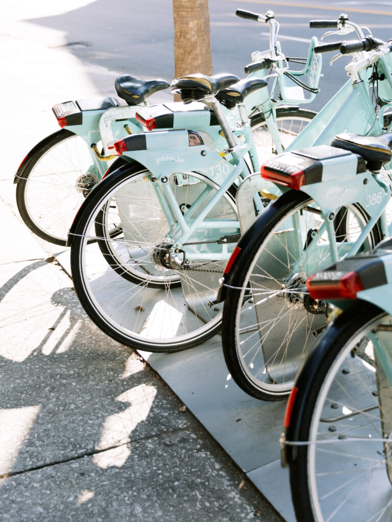 Bikes are lined up next to each other suggesting the reader join a hobby-based group for social self care. 