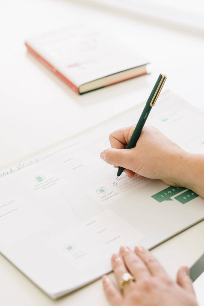 A woman writes in a planner. Make a Plan to bring social self care into your life