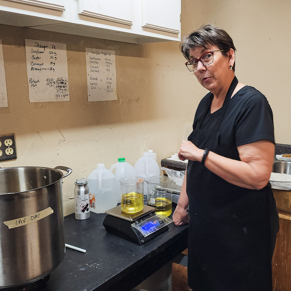 Susan measuring essential oils for natural soap
